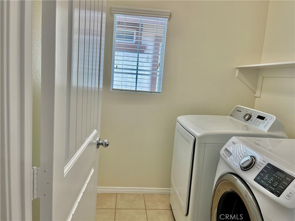 736 Tangelo Way Fullerton, CA 92832 - Photo 30 of 36 a utility room with dryer and washer