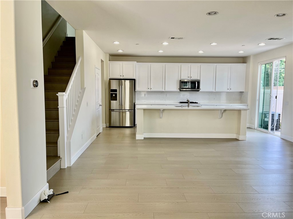 736 Tangelo Way Fullerton, CA 92832 - Photo 3 of 36 a view of kitchen with wooden floor and electronic appliances