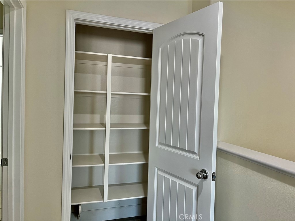 736 Tangelo Way Fullerton, CA 92832 - Photo 31 of 36 a view of walk in closet with empty racks