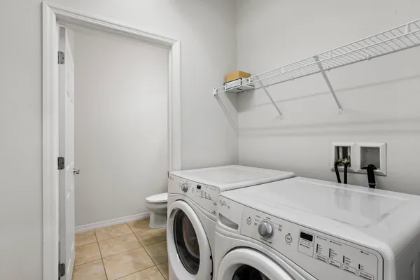 a view of a livingroom with a ceiling fan and wooden floor
