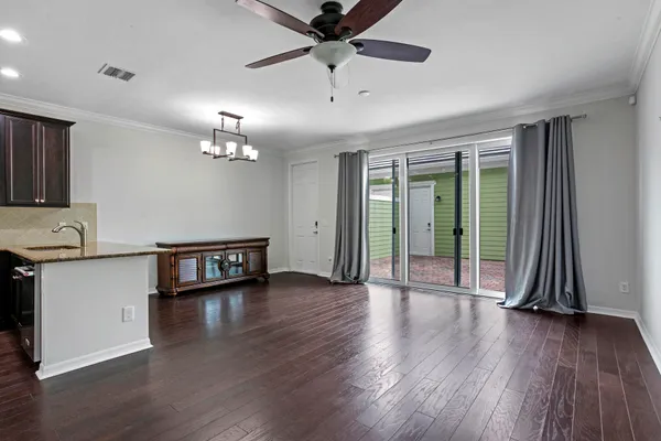 a bathroom with a granite countertop sink toilet and a mirror
