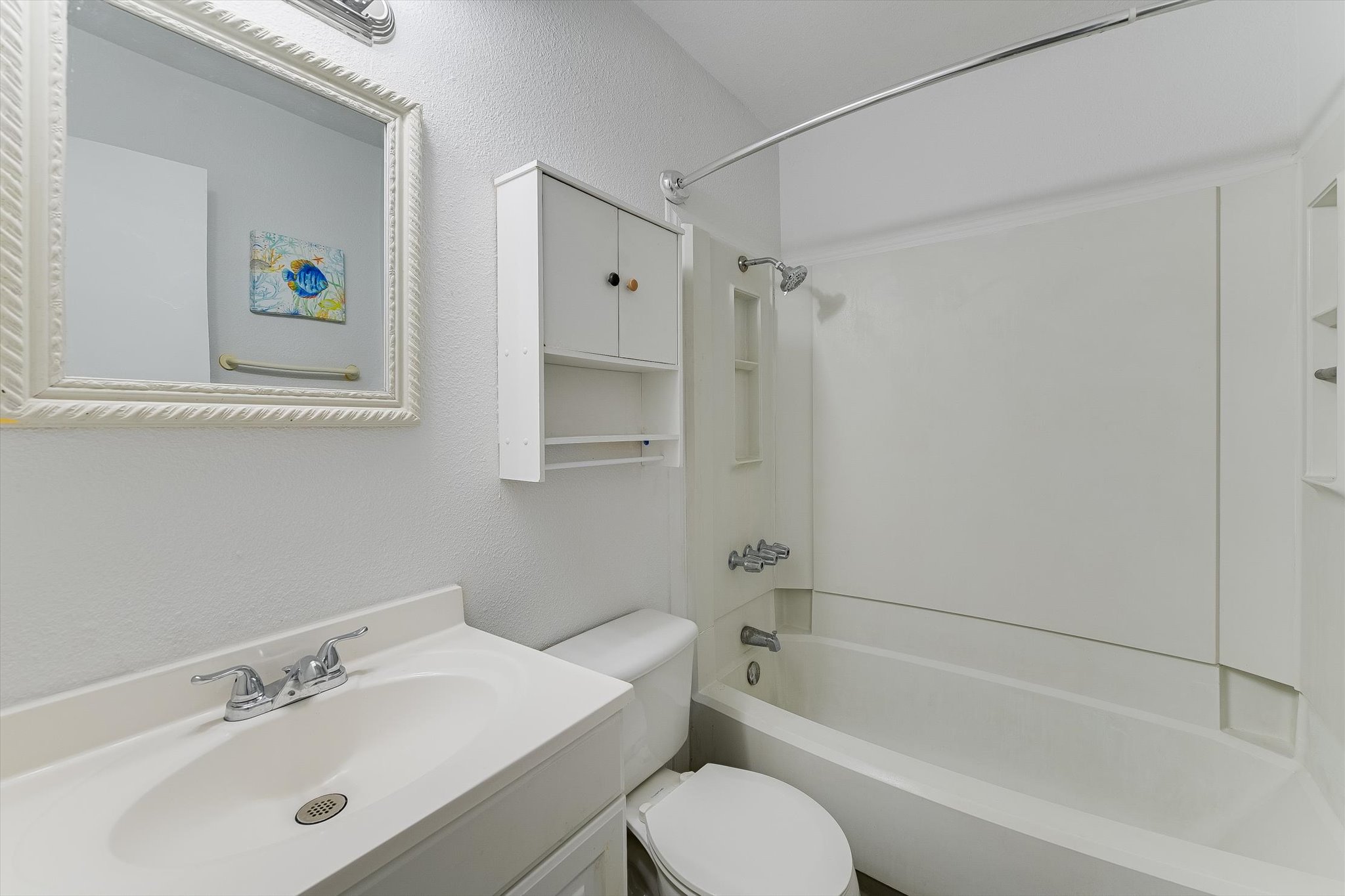 4301 Acropolis Court, Unit B Austin, TX 78759 - Photo 7 of 10 Full bathroom featuring a textured wall, vanity, and shower / bath combination