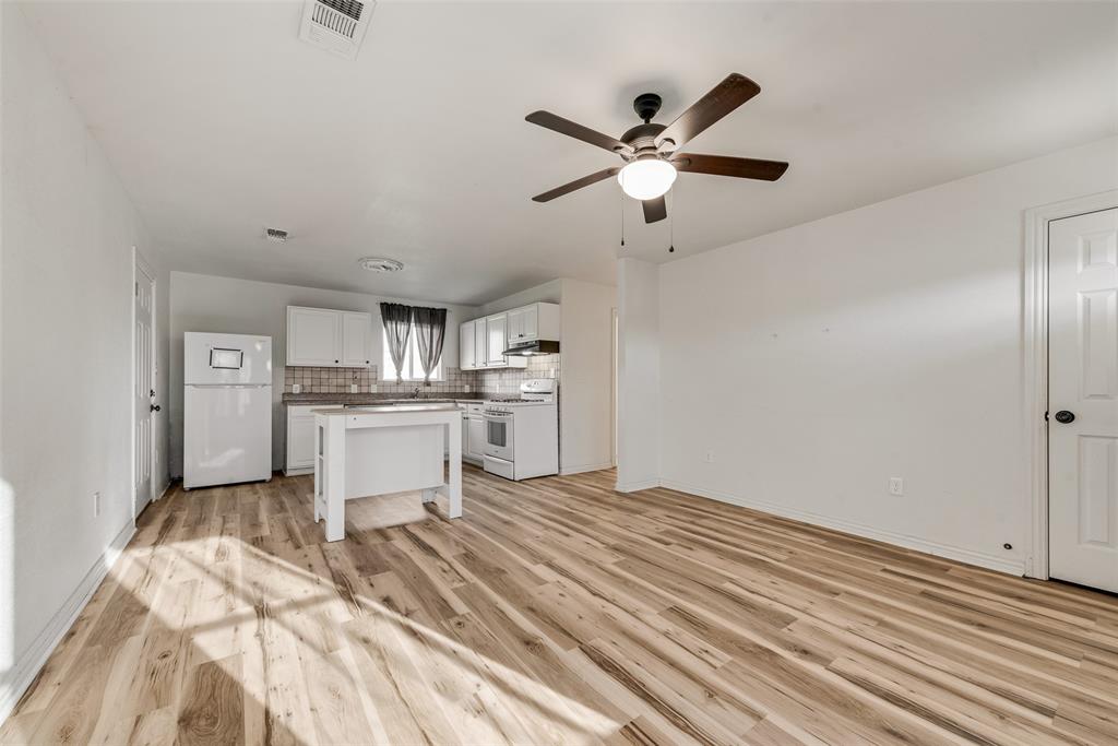 1303 South Medora Street Terrell, TX 75160 - Photo 3 of 12 a view of kitchen with sink and refrigerator