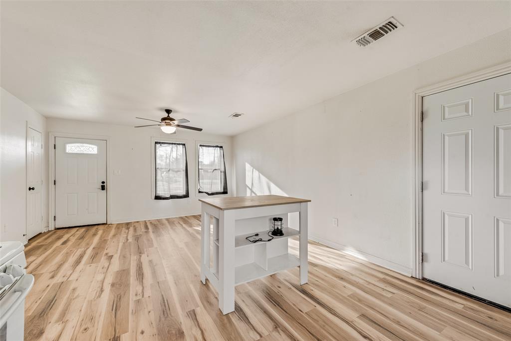 1303 South Medora Street Terrell, TX 75160 - Photo 6 of 12 wooden floor in an empty room with a window