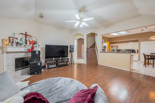 a living room with furniture and a flat screen tv