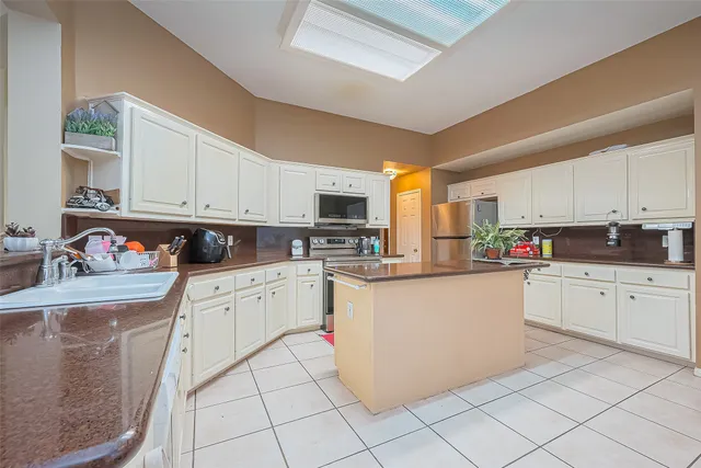 a bathroom with a sink a mirror and toilet