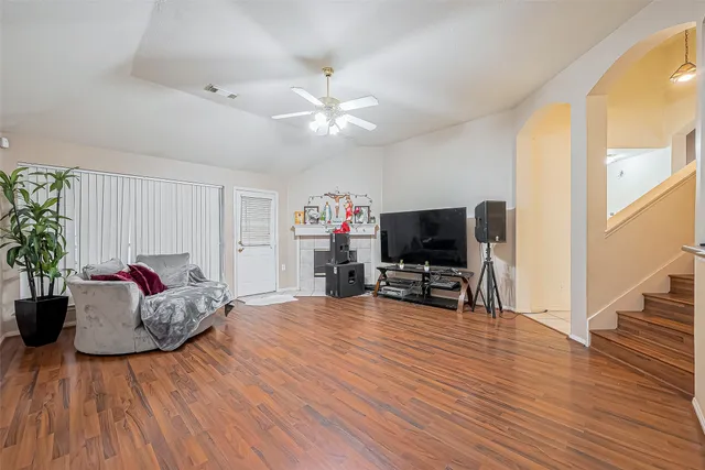 a living room with furniture and a flat screen tv