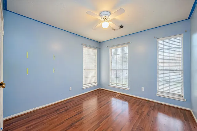 a bathroom with a sink mirror and a bathtub