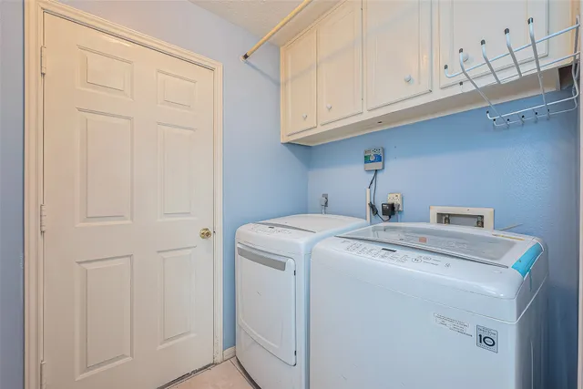 a view of a porch with furniture and a yard