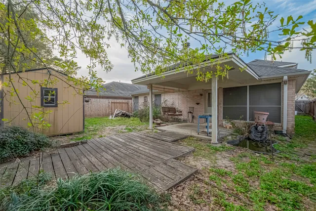 a backyard of a house with lots of green space
