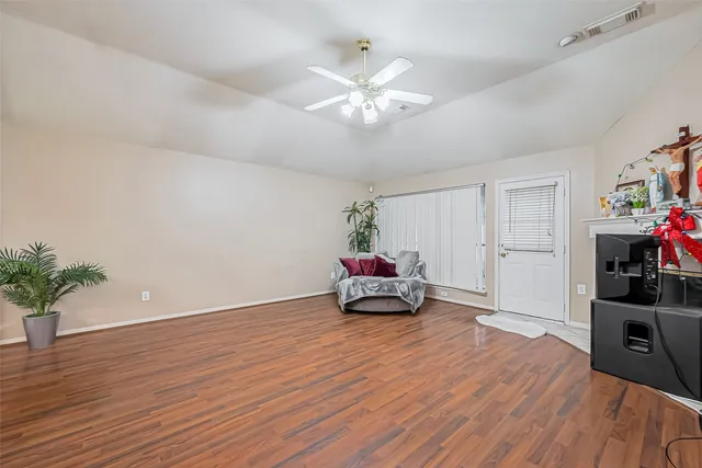 a view of a hallway with entryway of a house