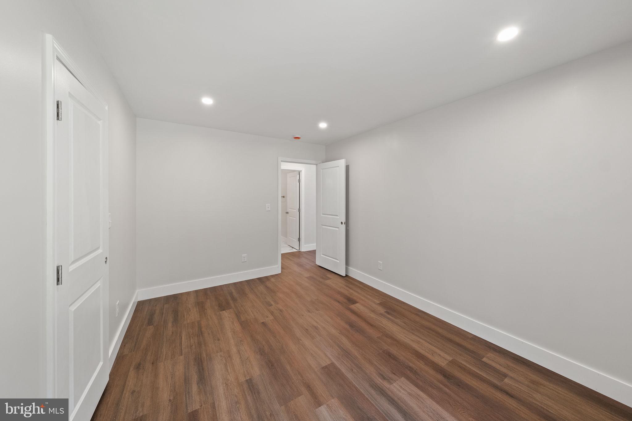 646 Sandy Point Road Heathsville, VA 22473 - Photo 14 of 39 a view of an empty room with wooden floor