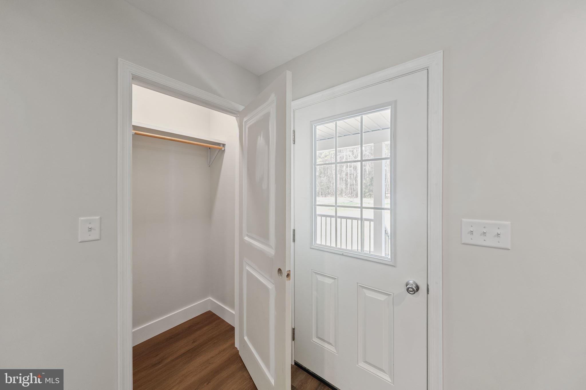 646 Sandy Point Road Heathsville, VA 22473 - Photo 16 of 39 a view of small space with wooden floor and closet