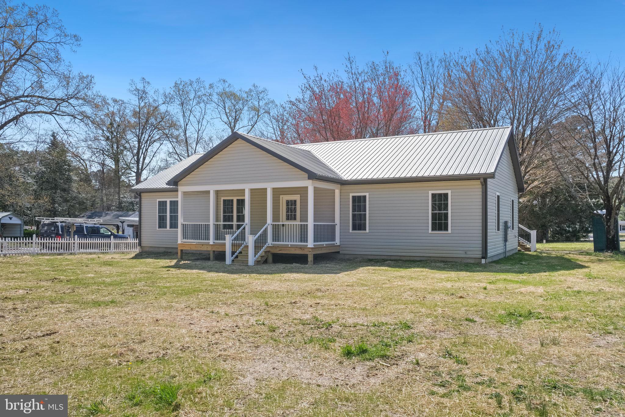 646 Sandy Point Road Heathsville, VA 22473 - Photo 3 of 39 a view of a house with a yard