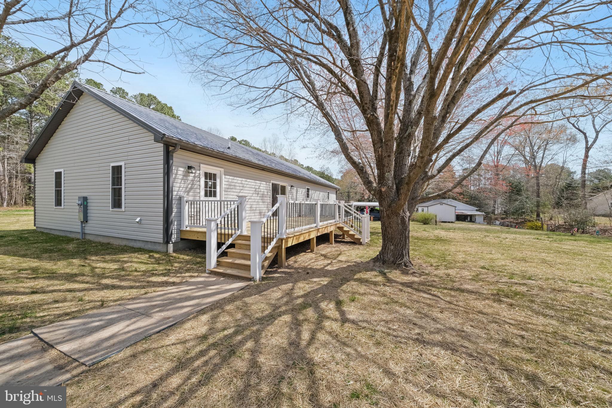 646 Sandy Point Road Heathsville, VA 22473 - Photo 4 of 39 a view of a house with a yard