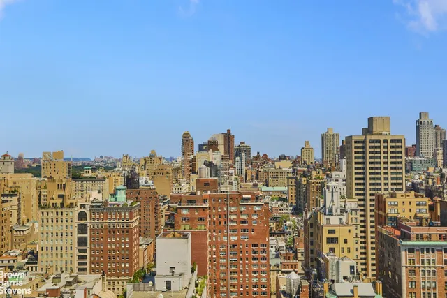 a view of a city with tall buildings