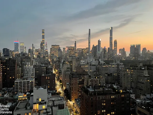 a view of a city with tall buildings