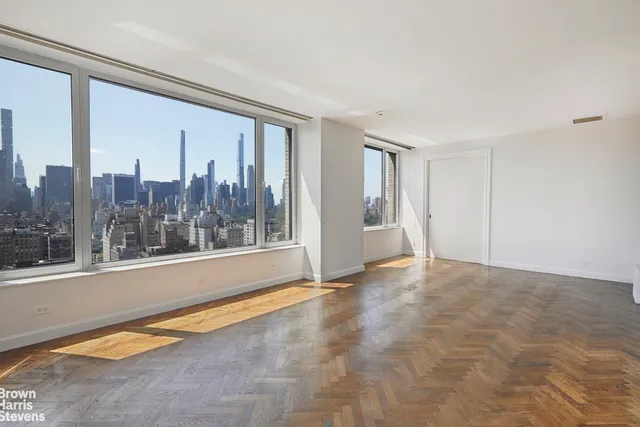 a view of a room with a large window