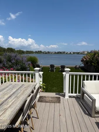 swimming view of a house with a patio