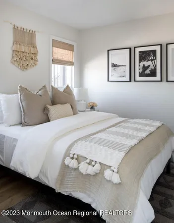 a bedroom with bed and window