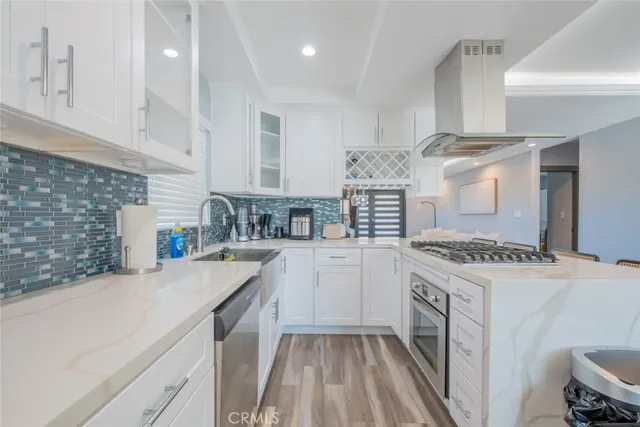 a kitchen with a stove oven and sink