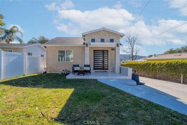 a view of a house with pool yard and patio