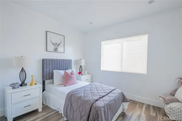 a bedroom with bed and window