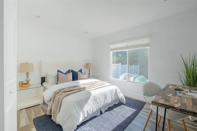 a bedroom with a bed and a table in it