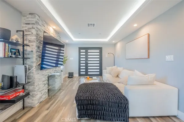 a bedroom with a bed and a couch