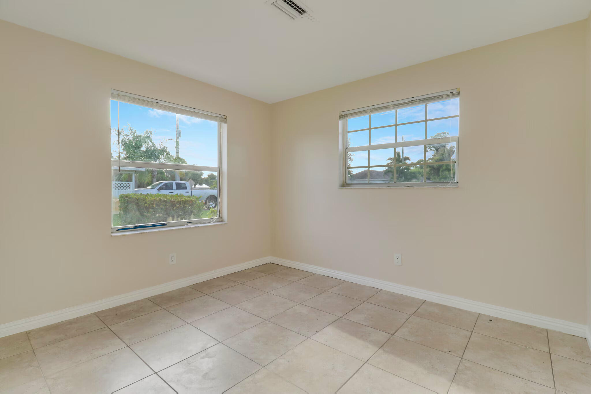 2777 Southeast Normand Street Stuart, FL 34997 - Photo 11 of 14 an empty room with windows