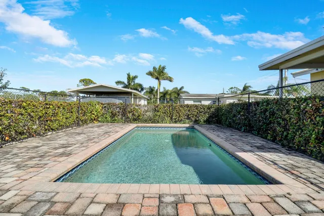 a kitchen with a sink stainless steel appliances and cabinets