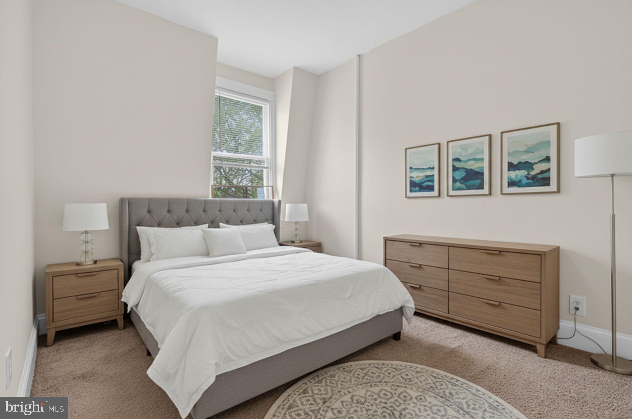 15 3rd Street Northeast, Unit 5 Washington, DC 20002 - Photo 19 of 24 a bedroom with a bed and a window