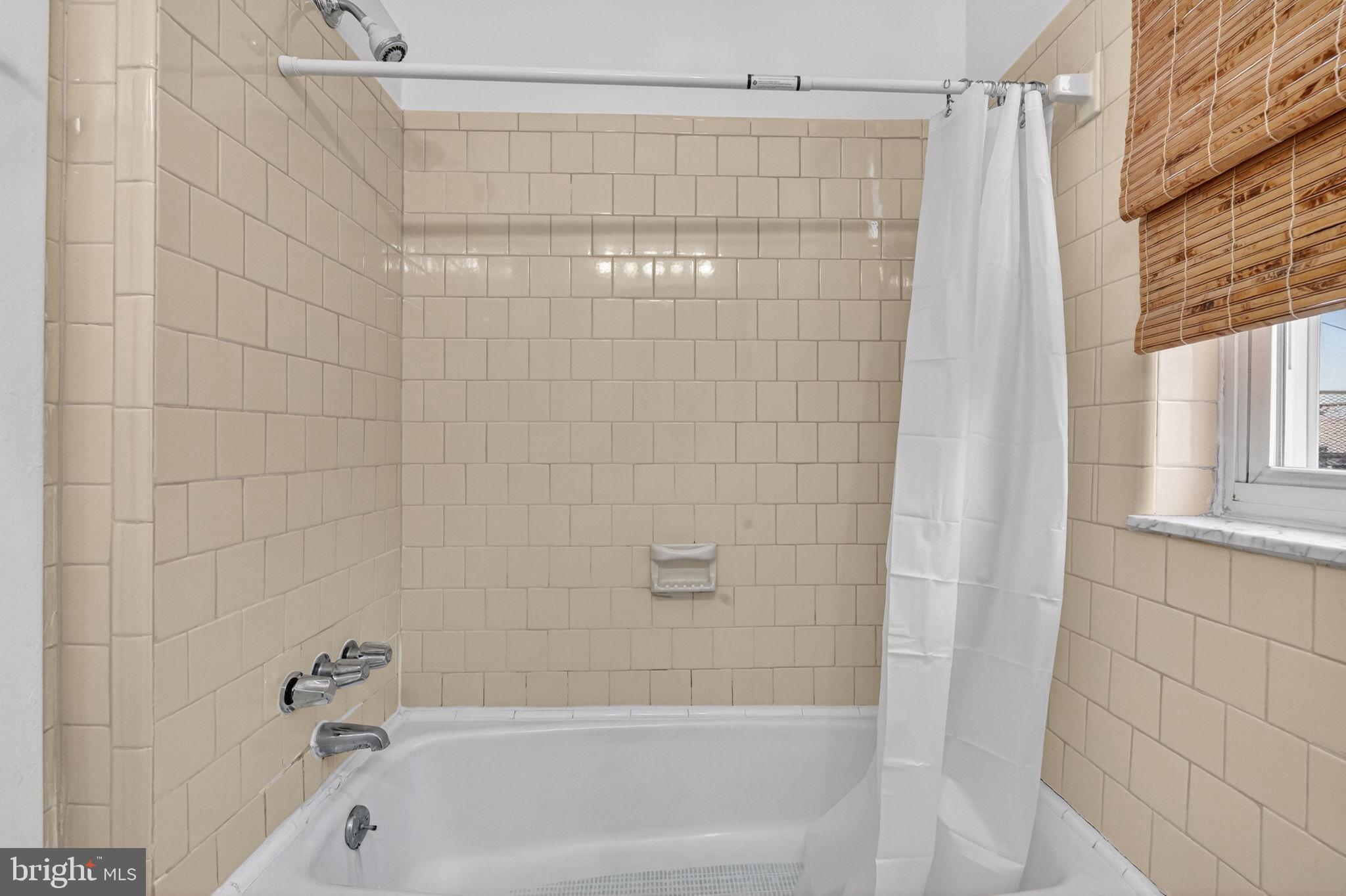 15 3rd Street Northeast, Unit 5 Washington, DC 20002 - Photo 23 of 24 a bathroom with a shower and a bathtub