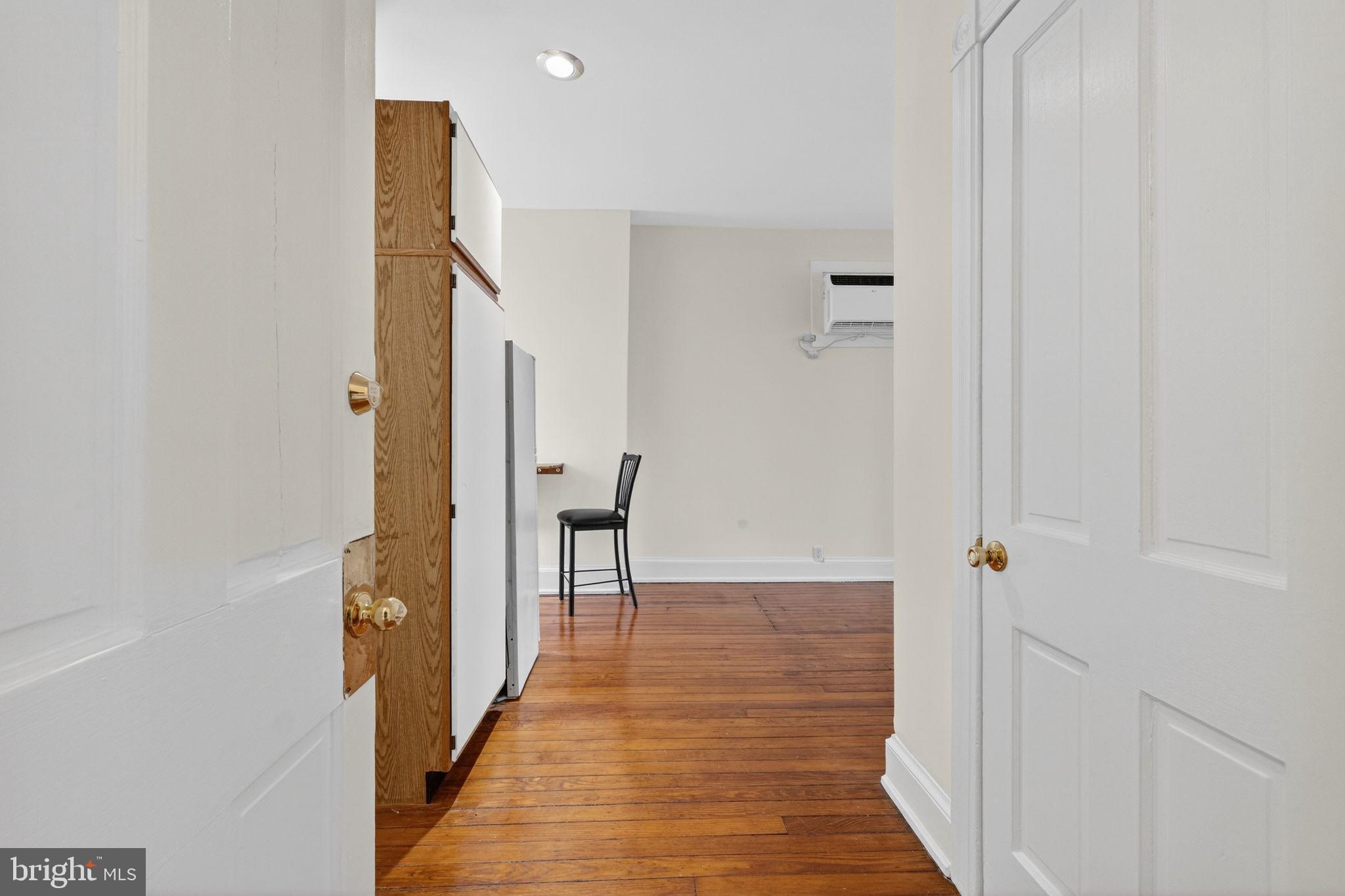 15 3rd Street Northeast, Unit 5 Washington, DC 20002 - Photo 6 of 24 a view of a hallway with wooden floor and staircase