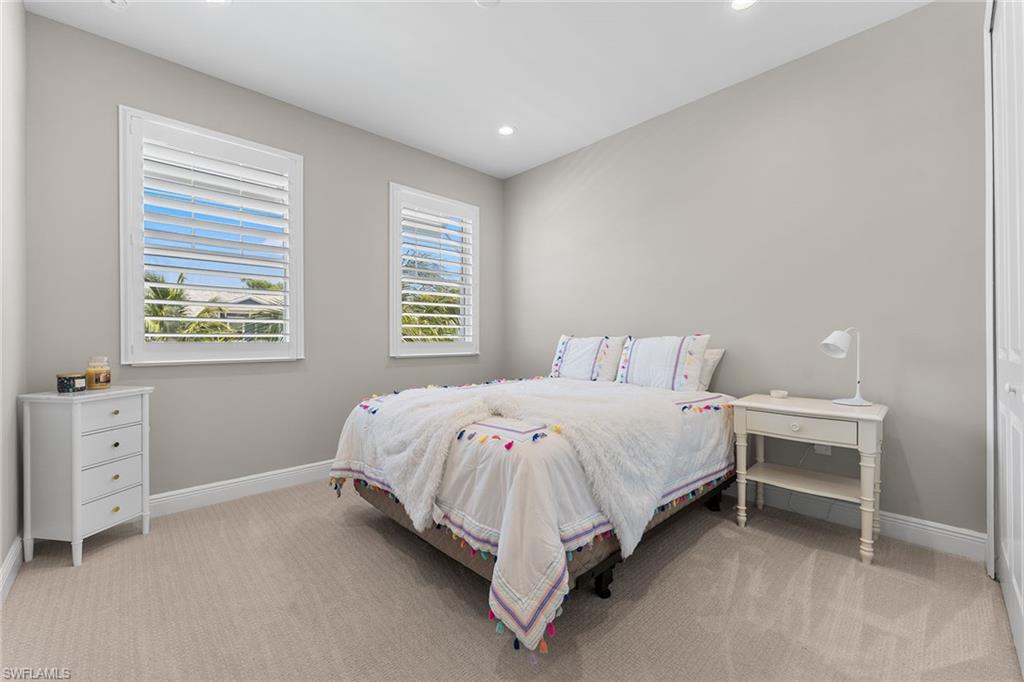 2609 Seychelles Circle, Unit 1608 Naples, FL 34112 - Photo 18 of 35 a bed room with a bed and a window