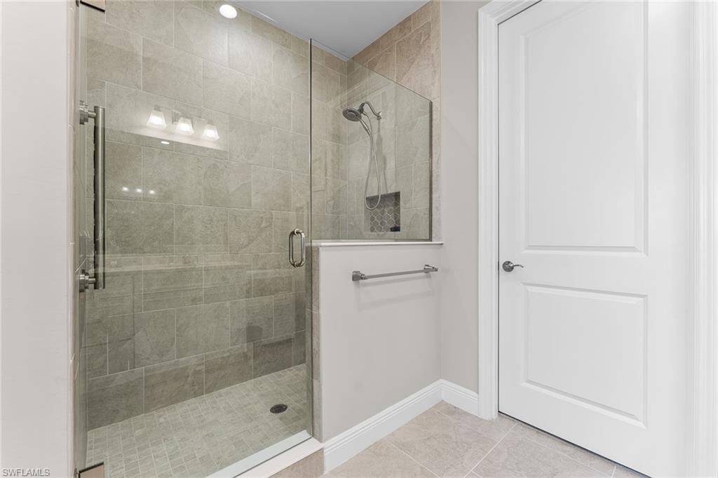 2609 Seychelles Circle, Unit 1608 Naples, FL 34112 - Photo 22 of 35 a bathroom with a shower