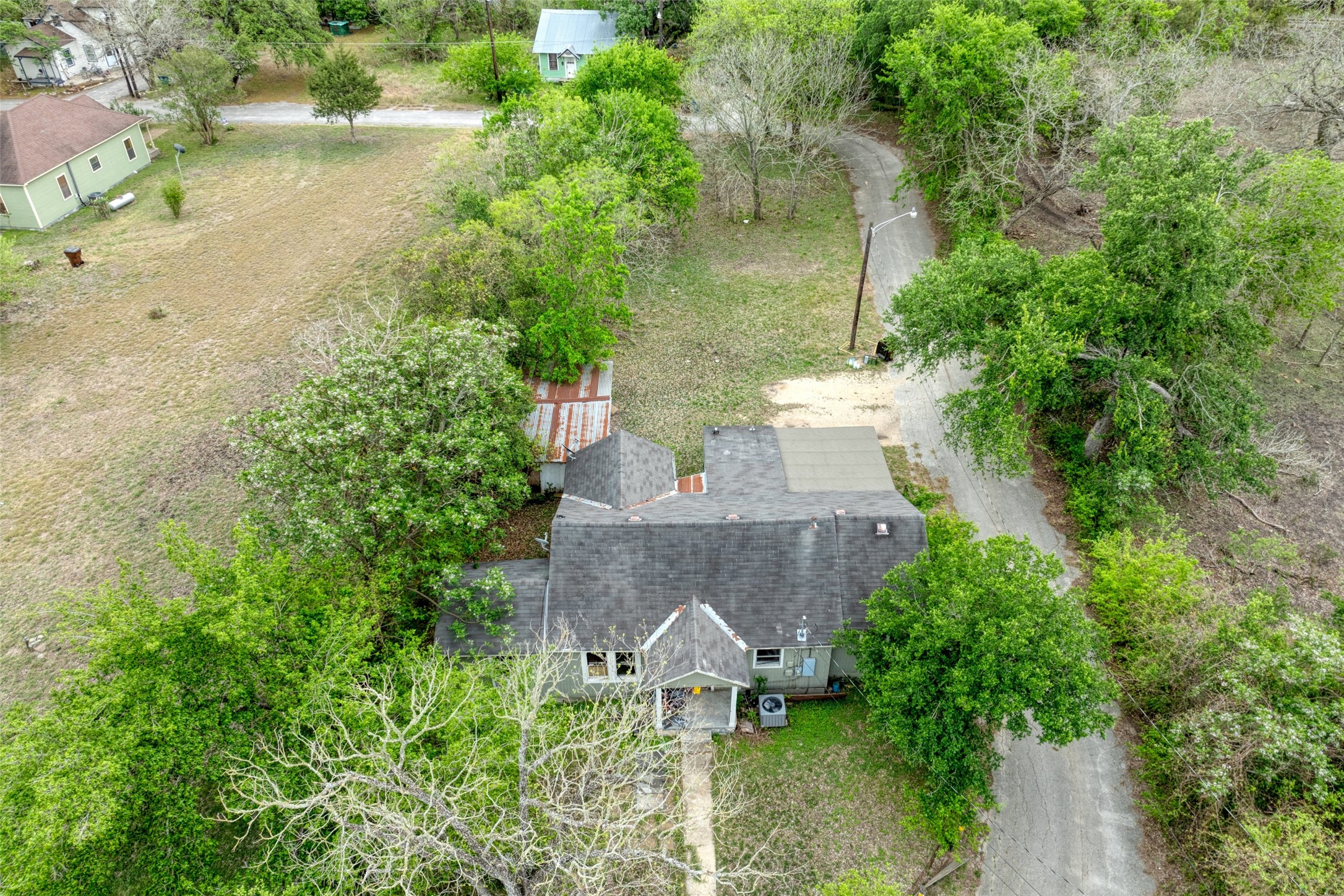 1006 Proctor Street Lockhart, TX 78644 - Photo 2 of 24 an aerial view of a house with a yard