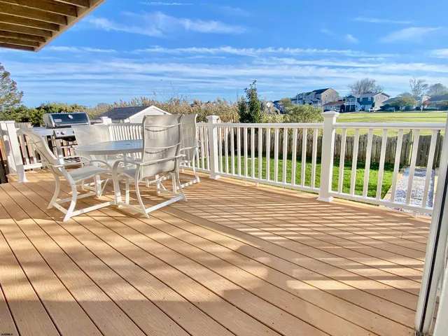 a view of a room with shelves and wooden floor