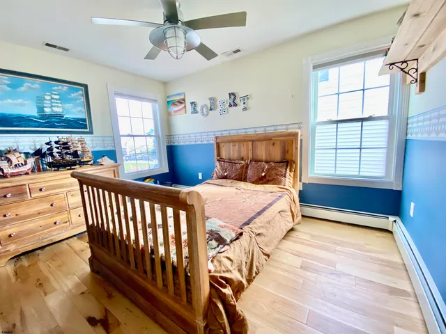 a bathroom with a tub sink and a window