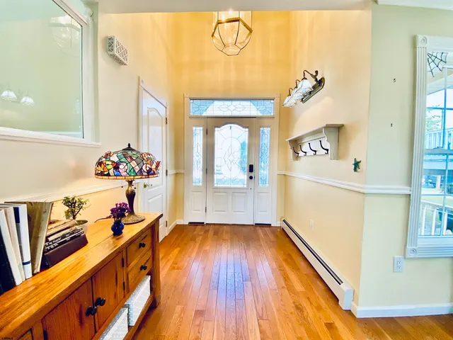 a living room with furniture and a book shelf