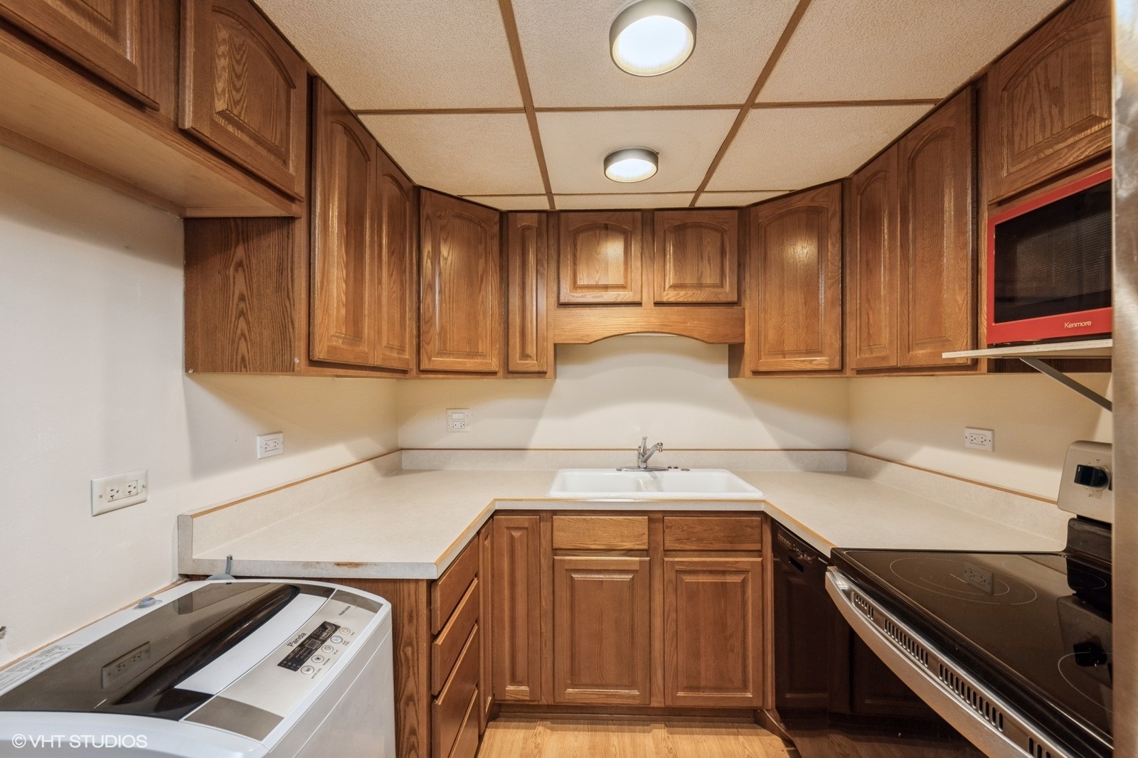 3325 Kirchoff Road, Unit 3E Rolling Meadows, IL 60008 - Photo 3 of 10 a kitchen with a sink appliances and cabinets