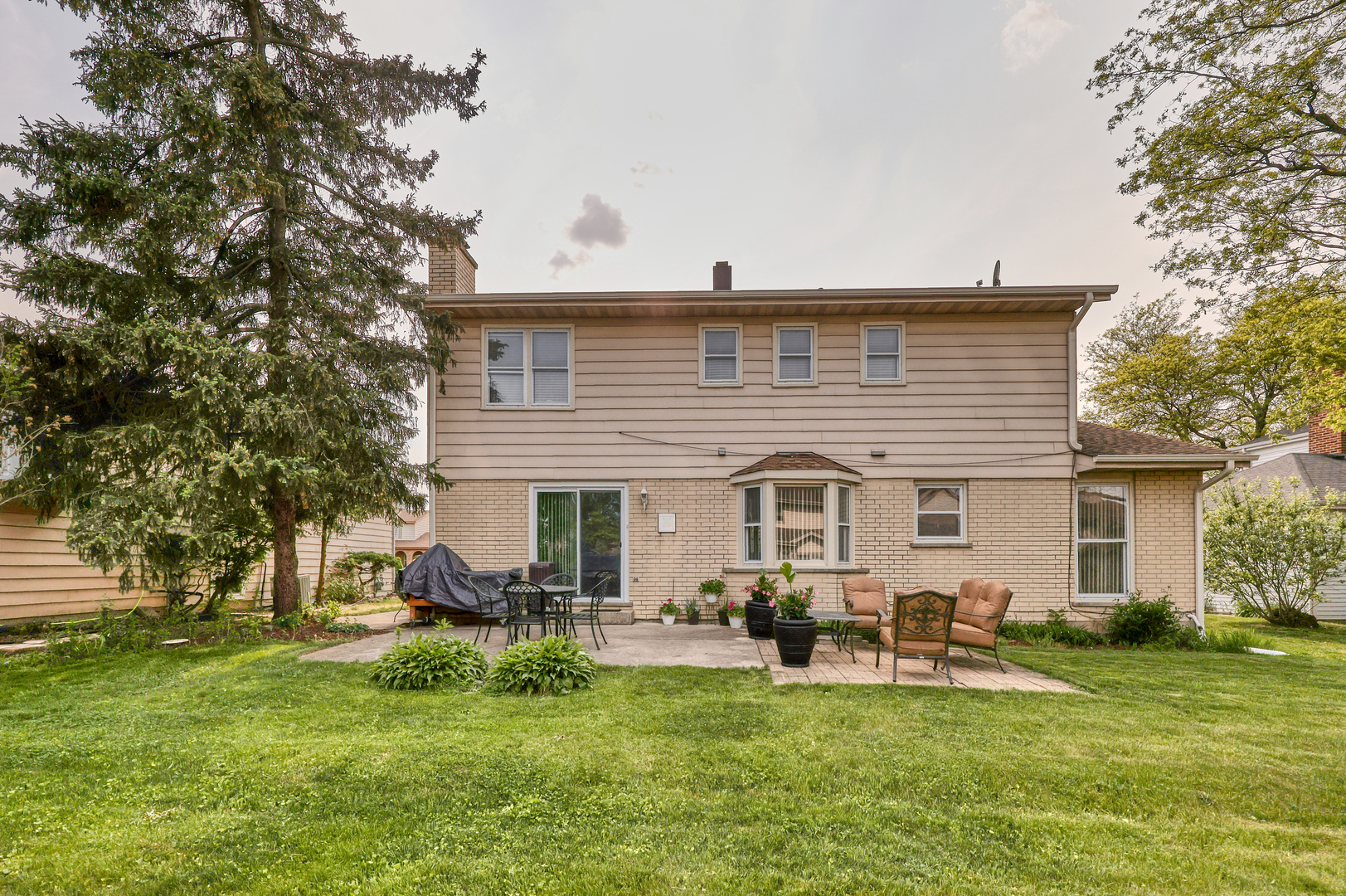 1121 Old Fence Road Addison, IL 60101 - Photo 31 of 33 a view of a house with a chairs in a patio