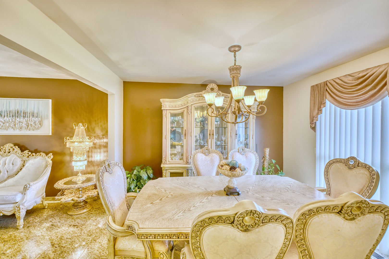 1121 Old Fence Road Addison, IL 60101 - Photo 6 of 33 a living room with dining table furniture and a chandelier