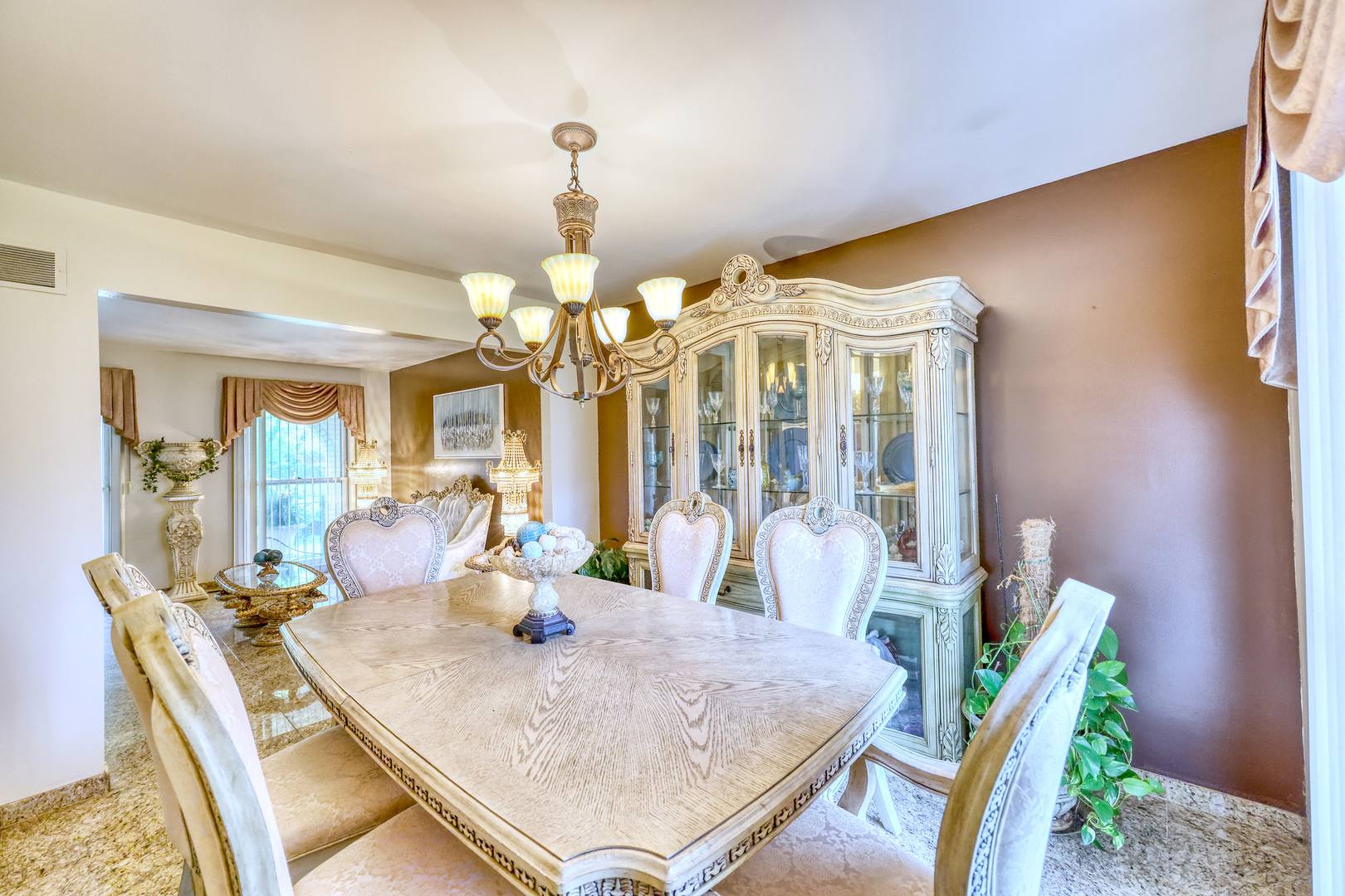 1121 Old Fence Road Addison, IL 60101 - Photo 7 of 33 a dining room with furniture and chandelier