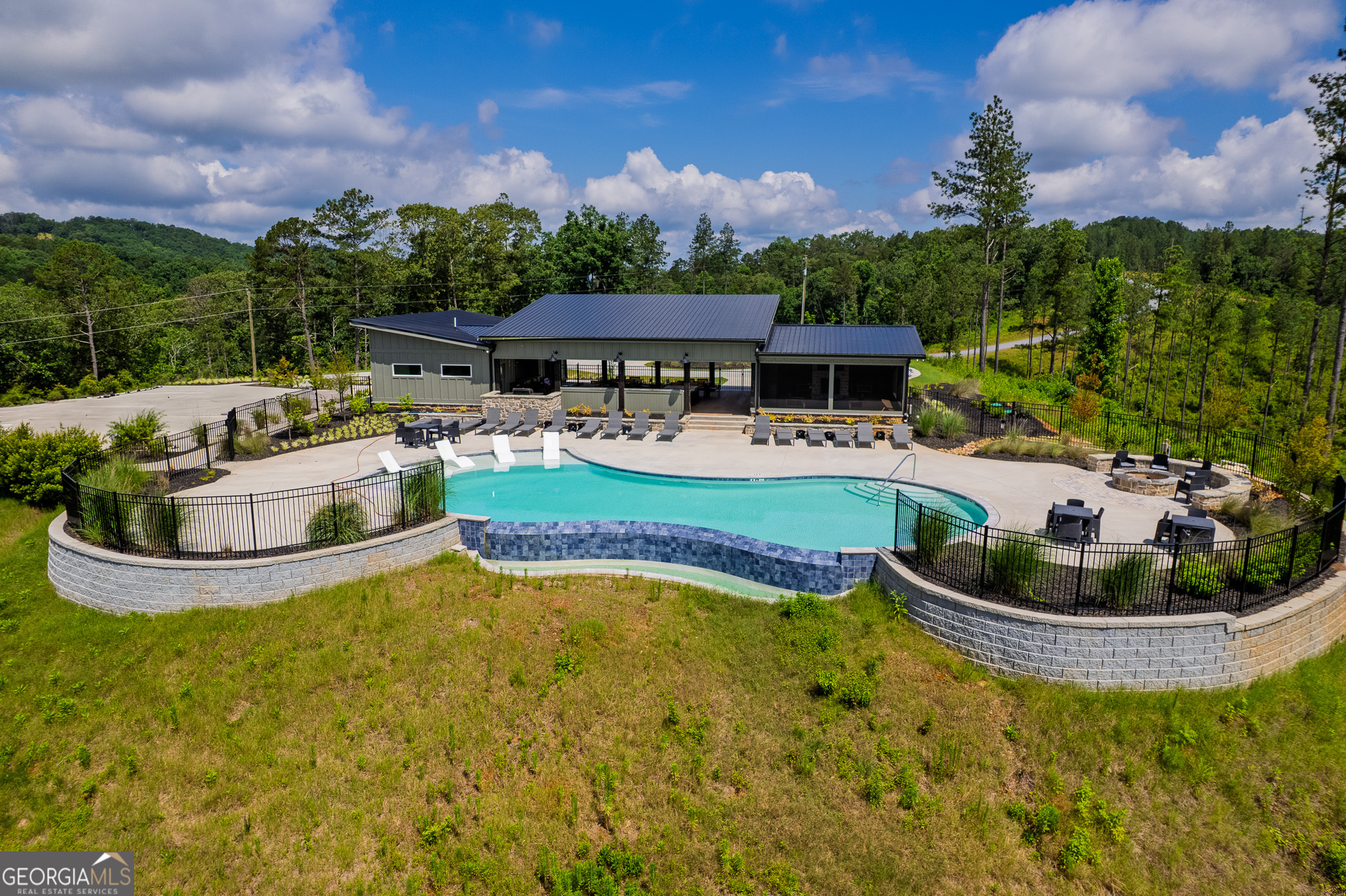 Lot 103 Blalock Mountain Road Talking Rock, GA 30175 - Photo 21 of 31 a view of a swimming pool with a patio