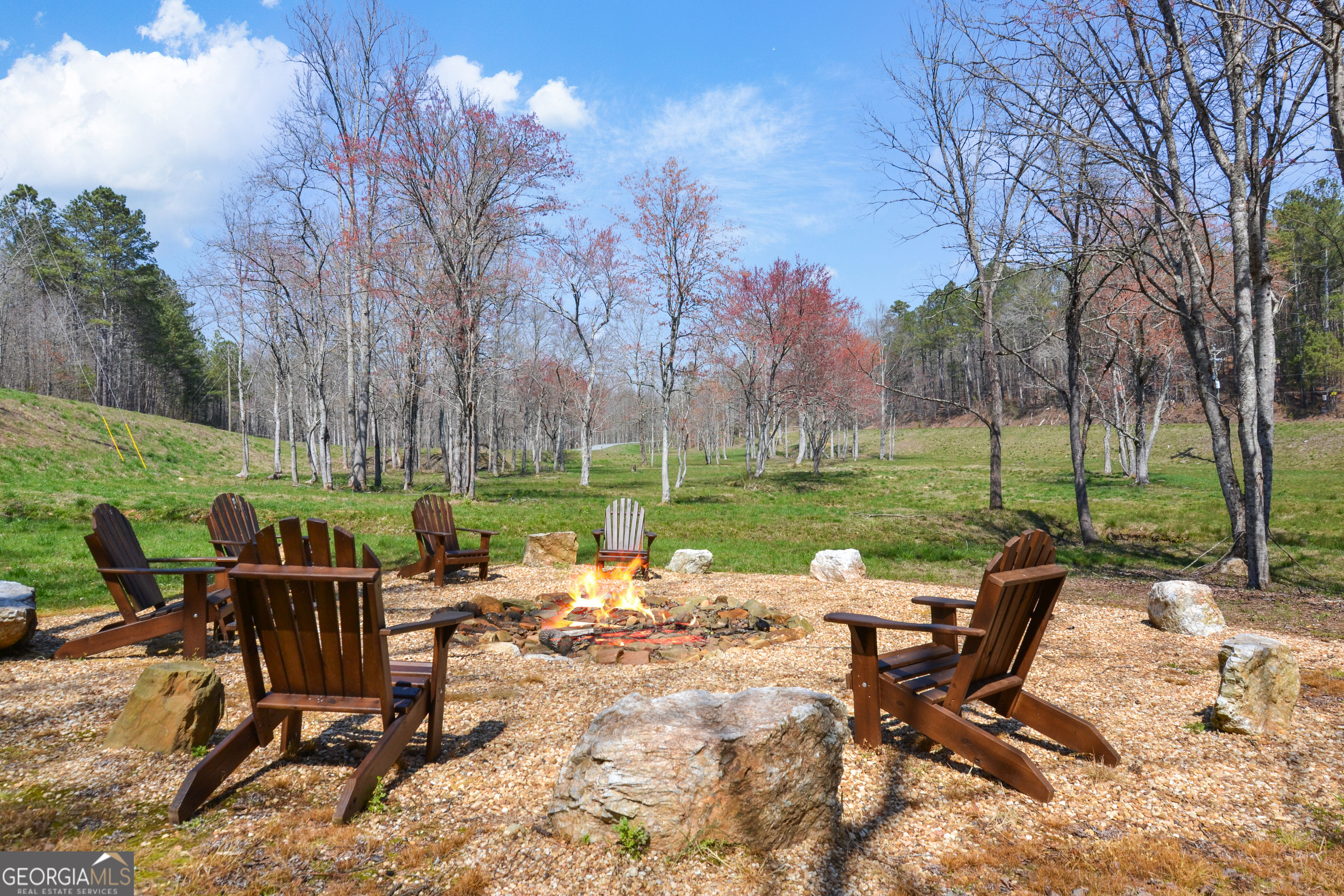 Lot 103 Blalock Mountain Road Talking Rock, GA 30175 - Photo 25 of 31 a view of a chairs and table in backyard of a park