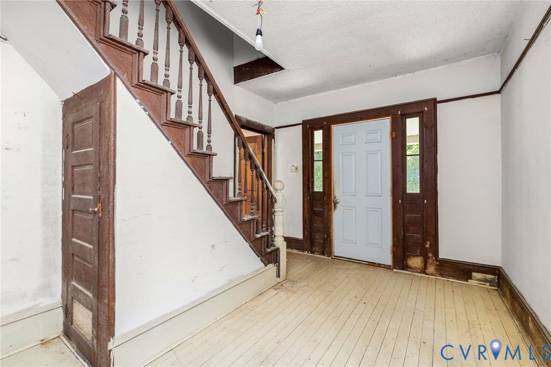 26081 Mason Road Jarratt, VA 23867 - Photo 6 of 49 Foyer featuring a prominent wooden staircase with