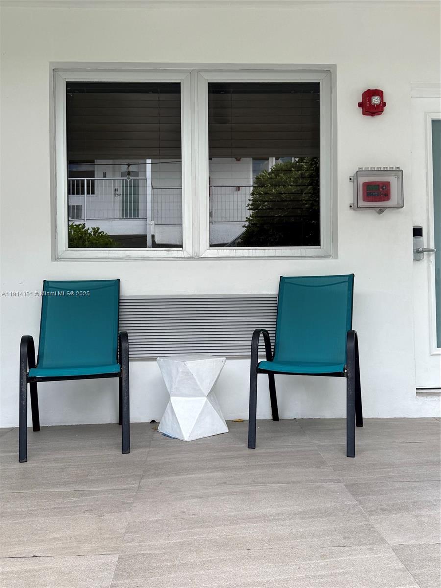 6755 Harding Avenue, Unit 3 Miami Beach, FL 33141 - Photo 7 of 7 a living room with furniture and a window