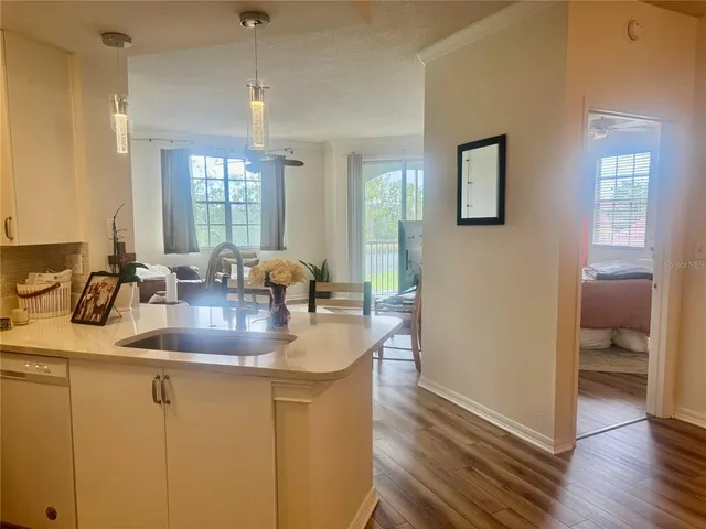 a kitchen with sink and window