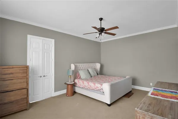 a bed room with a bed and a chandelier